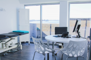 Lotus Dermatology specialist consultation room with view of Newcastle Harbour